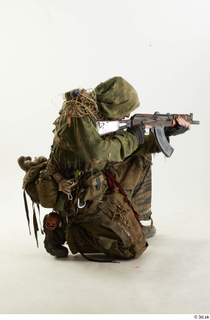 Photos John Hopkins Army Postapocalyptic Suit Poses aiming the gun…